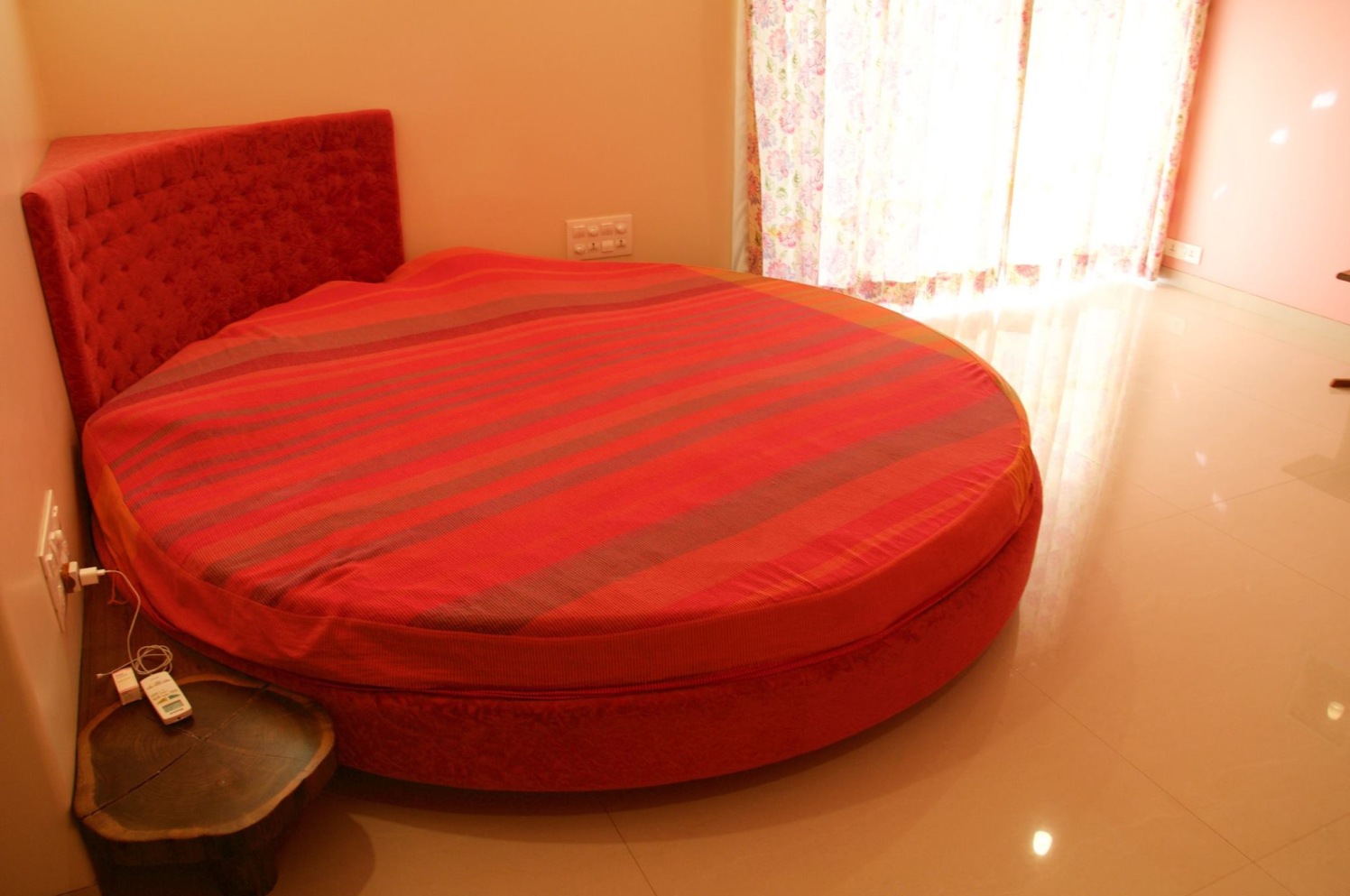 Simple bedroom with Round Red Bed with Marble Flooring by Viraf Laskari Bedroom Minimalistic | Interior Design Photos & Ideas
