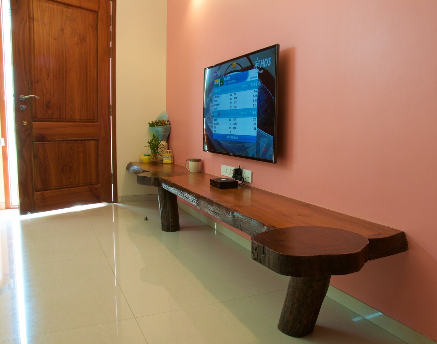 TV unit with Pink Wall and Wooden Display Unit by Viraf Laskari Living-room Minimalistic | Interior Design Photos & Ideas
