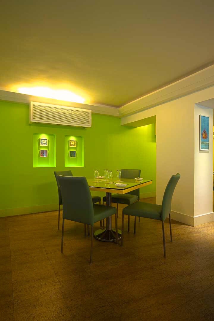Compact Dining Room With Wooden Flooring and Green Wall by Viraf Laskari Dining-room Modern | Interior Design Photos & Ideas