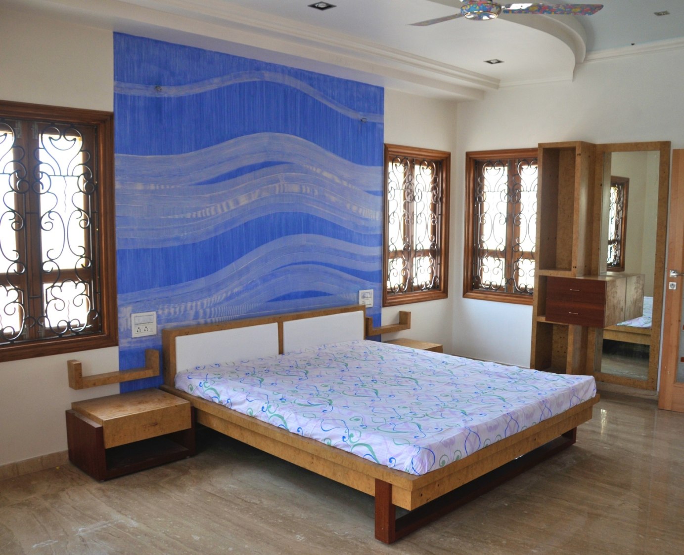 Wooden Low Rise Bed With Blue Wallpaper by Viraf Laskari Bedroom Contemporary | Interior Design Photos & Ideas