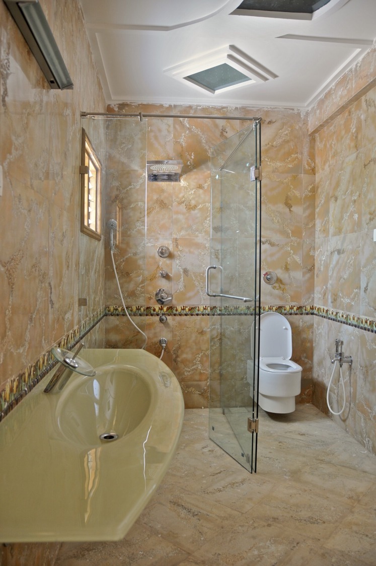 Bathroom With Textured Marble Flooring and Glass Shower Door by Viraf Laskari Bathroom Modern | Interior Design Photos & Ideas