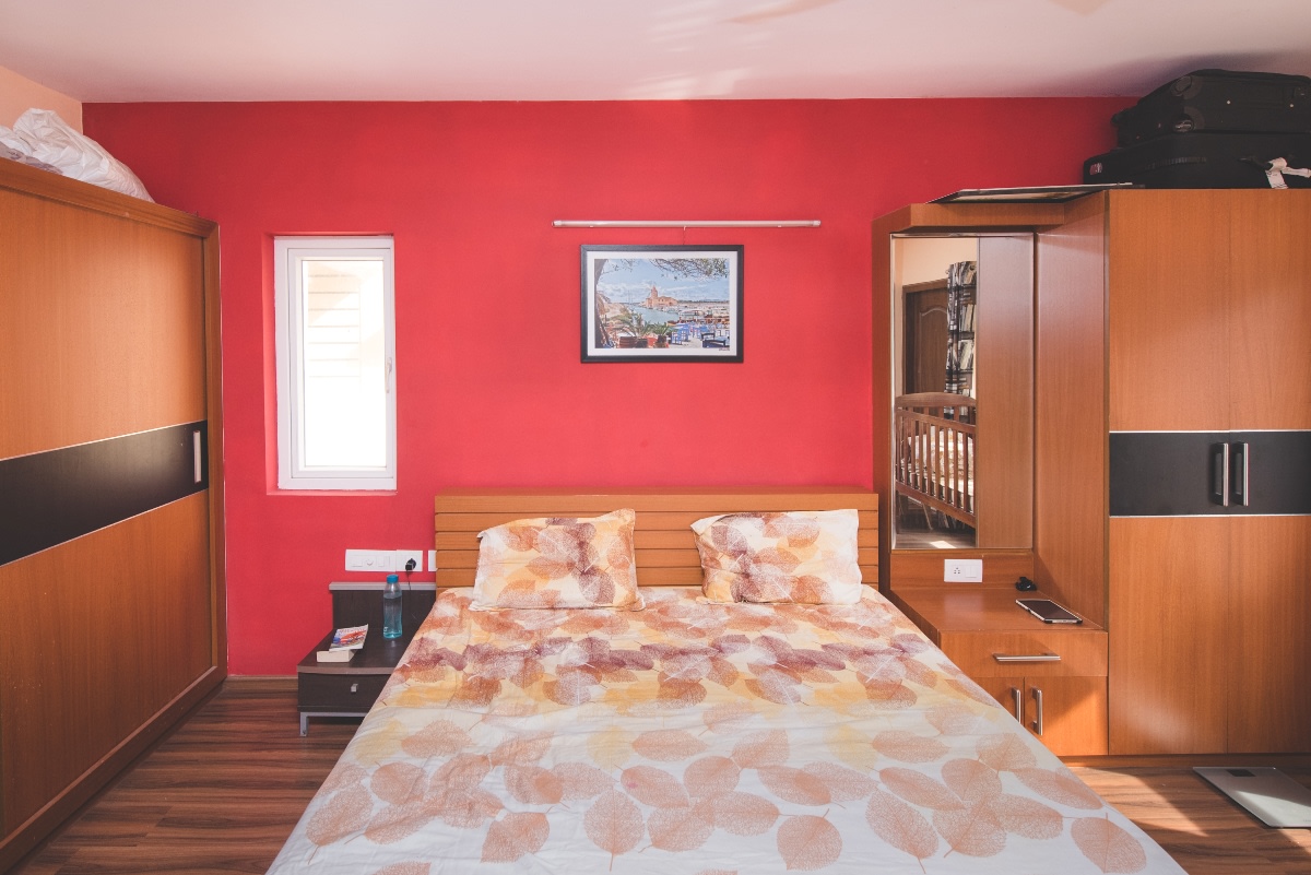 Bedroom With Wooden Theme And Red Wall Art by Huzzpa