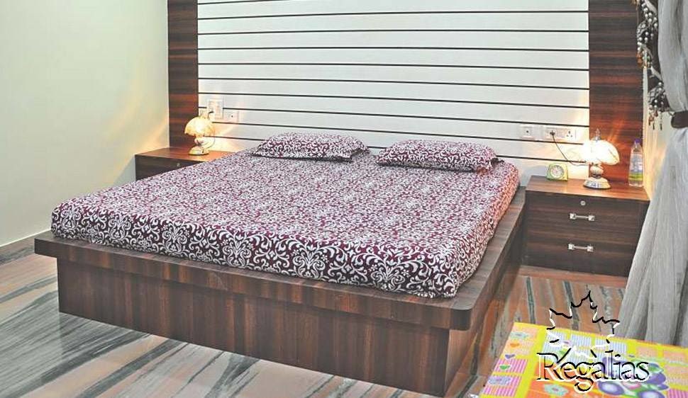 Wooden Finished Bedroom with Textured Back Wall by Regalias Interiors Bedroom Contemporary | Interior Design Photos & Ideas