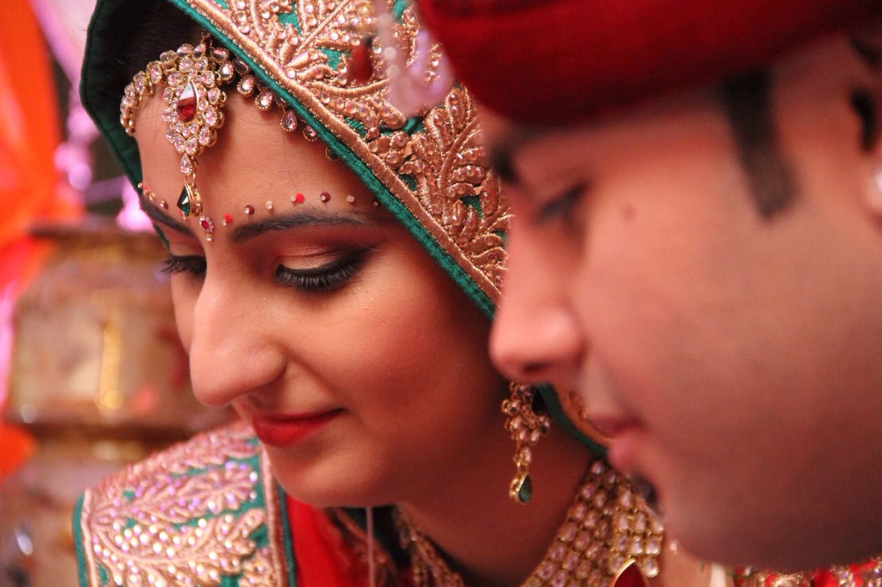 Crimson shades of bridal outfit and bridal makeup by Heena Video Wedding-photography Bridal-makeup | Weddings Photos & Ideas