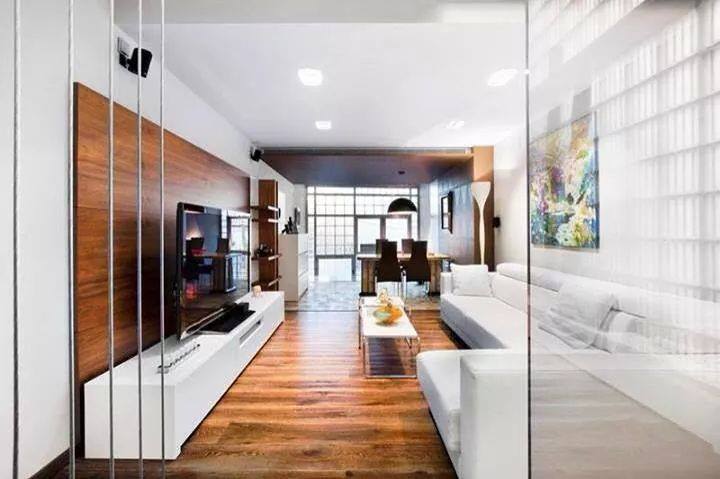 Living Room With White Sectional Sofa And Wooden Flooring by HOC Designarch Living-room Contemporary | Interior Design Photos & Ideas