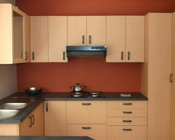 Sleek Wooden Kitchen Cabinets by Swastik Interiors Modular-kitchen Minimalistic | Interior Design Photos & Ideas