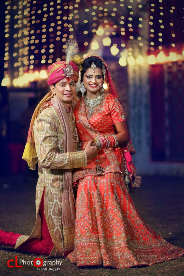 Orange Bridal Lehenga With Silver Detailing And Golden Sherwani With Maroon Chudidaar And Pink And Yellow Turban Completing Its Look With A Kilangi Brooch by CL Photography Wedding-photography Groom-wear-and-accessories Wedding-dresses | Weddings Photos & Ideas