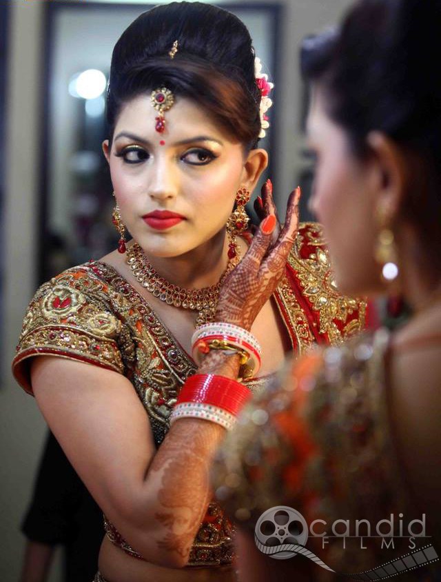 Bride getting ready by Candid Films Wedding-photography Bridal-jewellery-and-accessories Bridal-makeup | Weddings Photos & Ideas