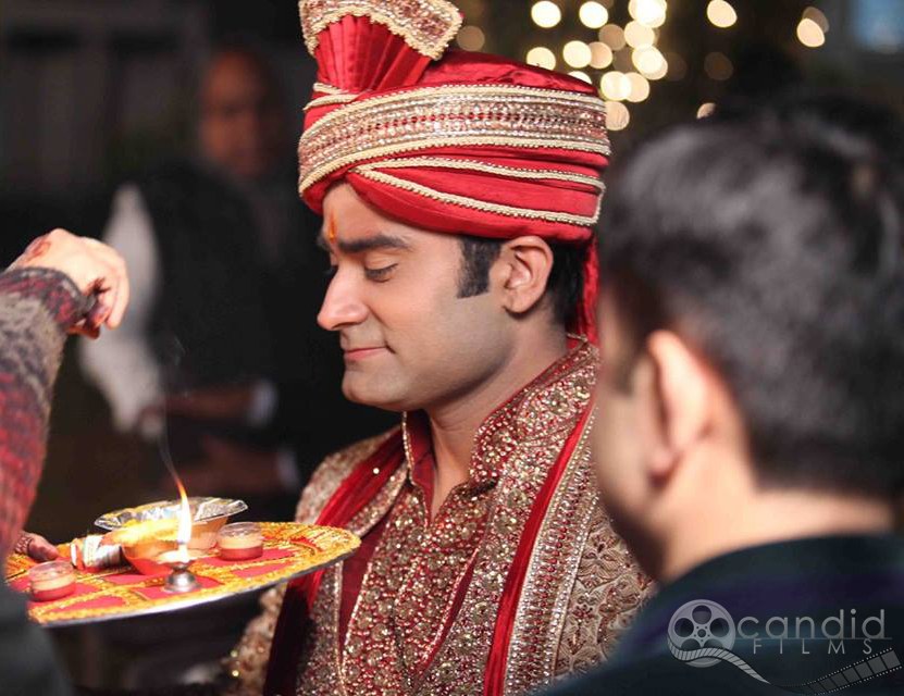 Groom's welcome by Candid Films Wedding-photography Groom-wear-and-accessories | Weddings Photos & Ideas