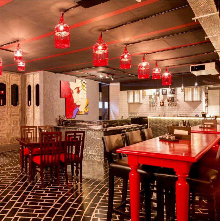 Refined Restaurant with Red Wooden Table And Brown Cushioned Side Chairs by Wood Works Club Modern | Interior Design Photos & Ideas