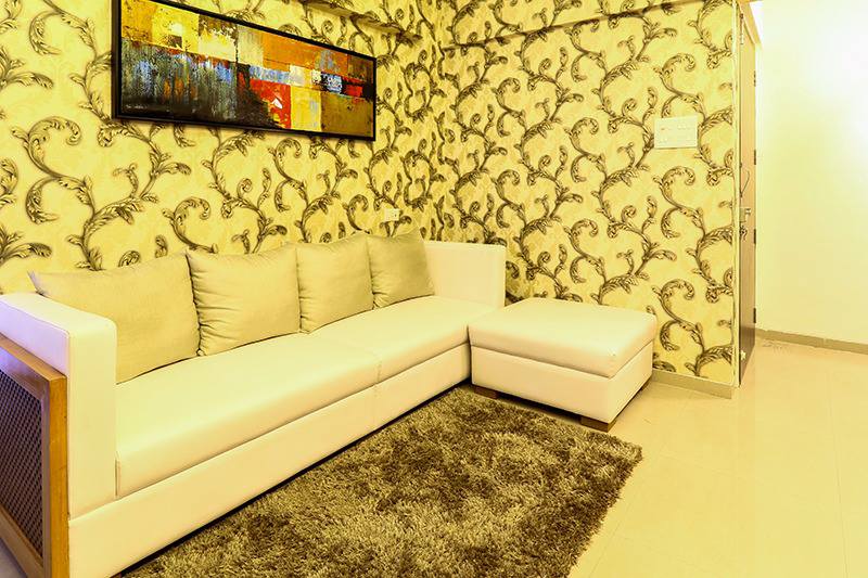 White Sectional Sofa And Wall With Golden Intricate Work by Wood Works Club Living-room Contemporary | Interior Design Photos & Ideas