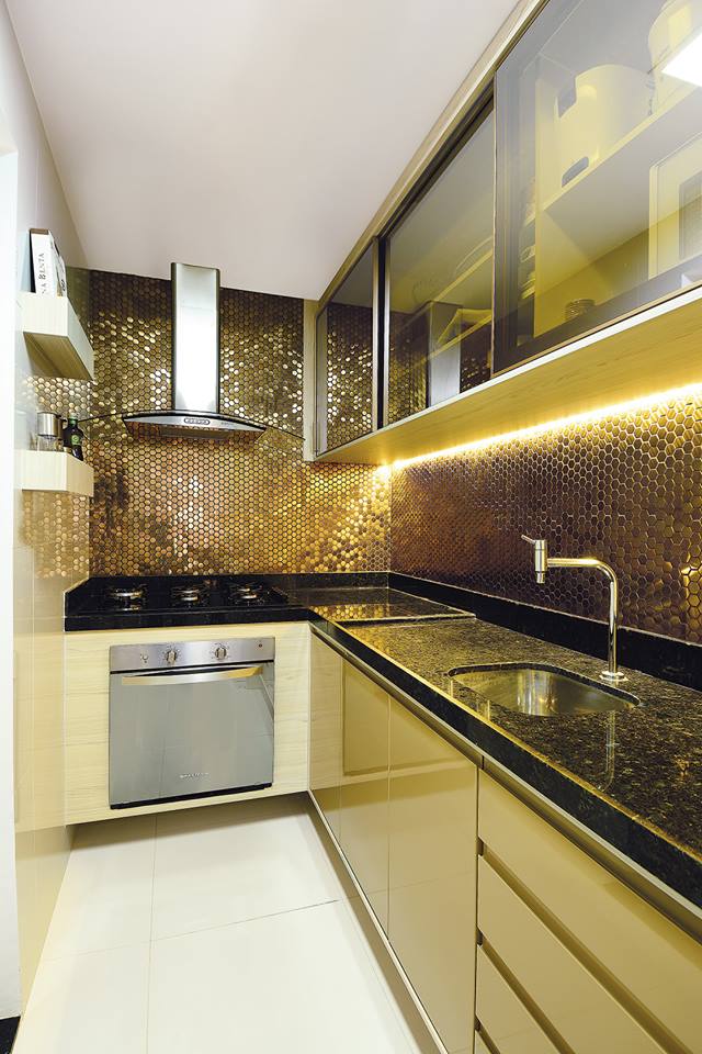 L-Shaped Modular Kitchen With Golden Shades by Icraft Desginz and interiors Modular-kitchen Modern | Interior Design Photos & Ideas