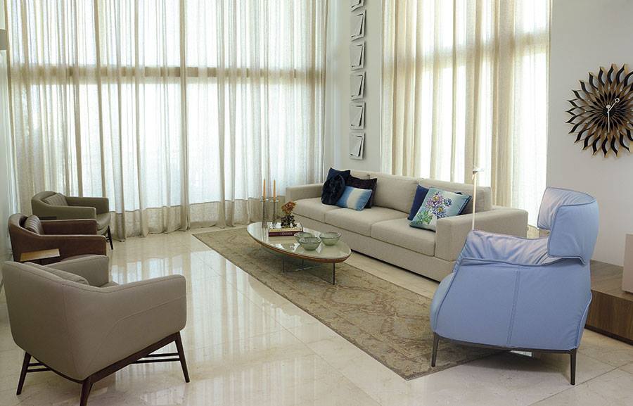 Beige Shaded Living Space With Blue Recliner by Icraft Desginz and interiors Living-room Modern | Interior Design Photos & Ideas
