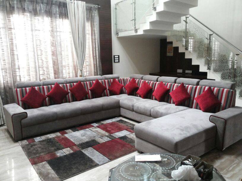 Grey Colored Sectional Sofa With Red Cushions For Living Space by Icraft Desginz and interiors Living-room Modern | Interior Design Photos & Ideas