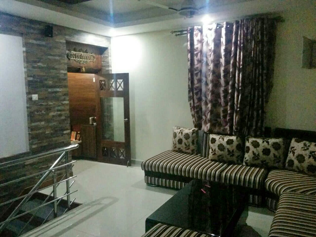 Living Room With Striped Sofa by Madhumathi. J. Dharwar Living-room Contemporary | Interior Design Photos & Ideas