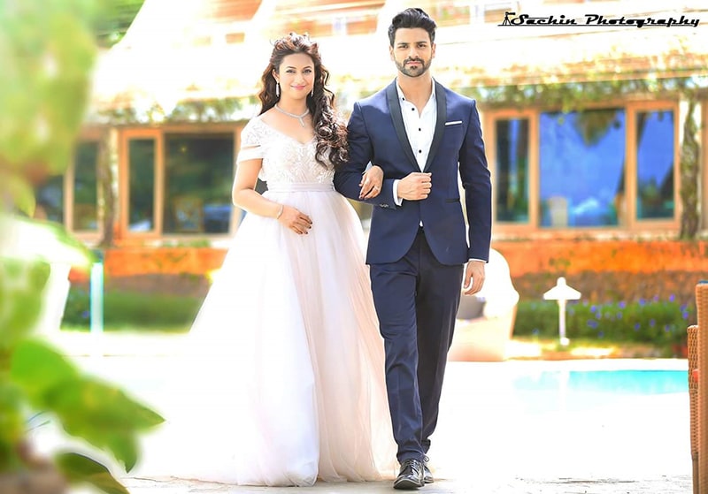 Alluring White Flare Ball Gown And Navy Blue Suit For Pre-Wedding Shoot by Sachin Kumar Wedding-photography Groom-wear-and-accessories Wedding-dresses | Weddings Photos & Ideas