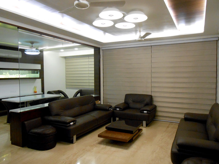 Elegant Looking Living Room with Black Leather Sofa Set and White False Ceiling by Shristi Interiors Living-room Modern | Interior Design Photos & Ideas