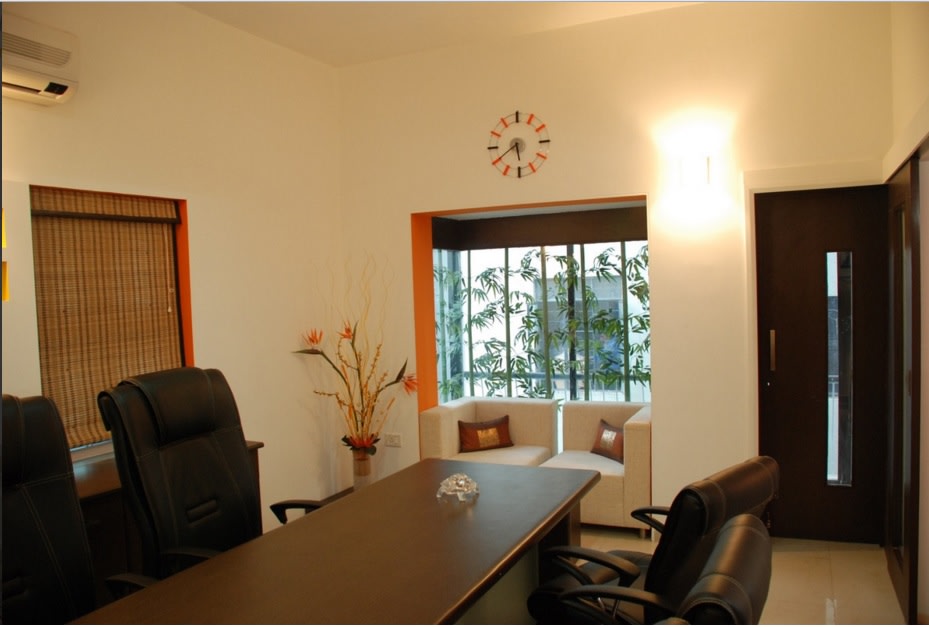 Organised Office Space with Wooden Top Table and Leather Seating by Shristi Interiors Modern | Interior Design Photos & Ideas