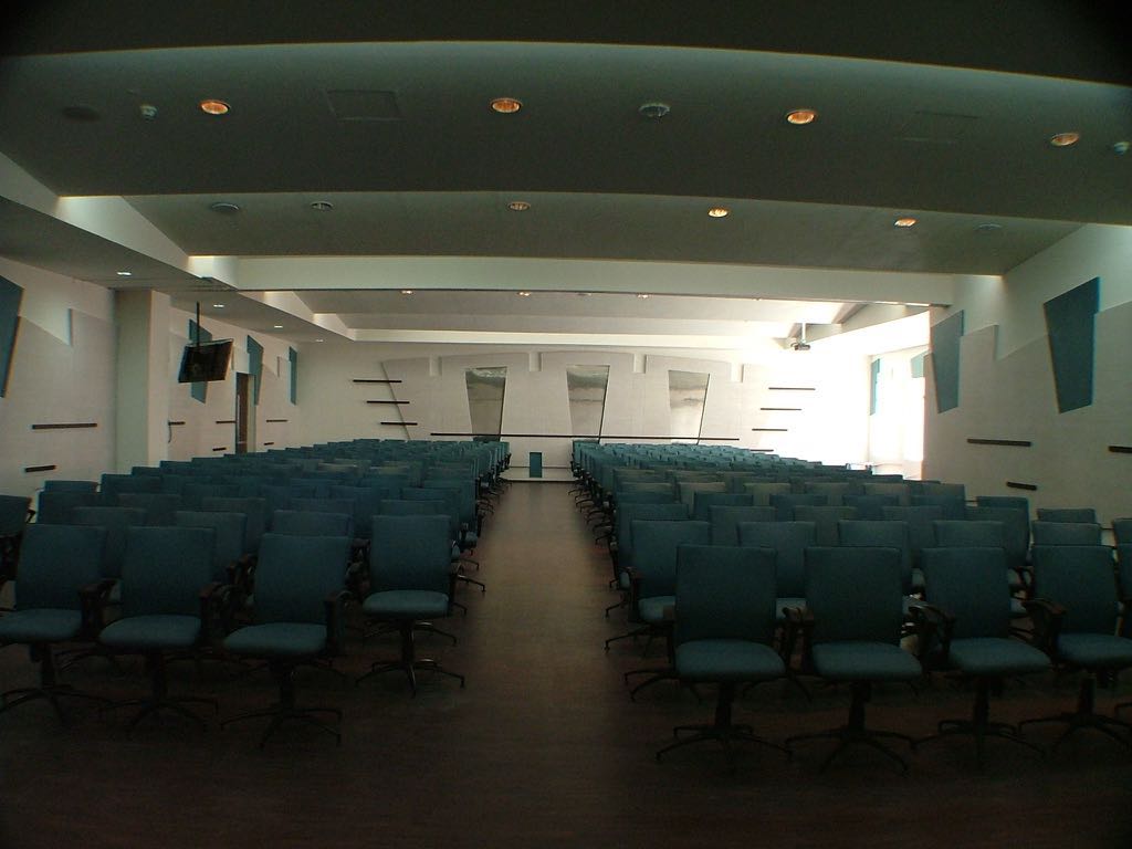 Spacious Auditorium With Blue Chairs by Mohit Kumar Modern | Interior Design Photos & Ideas