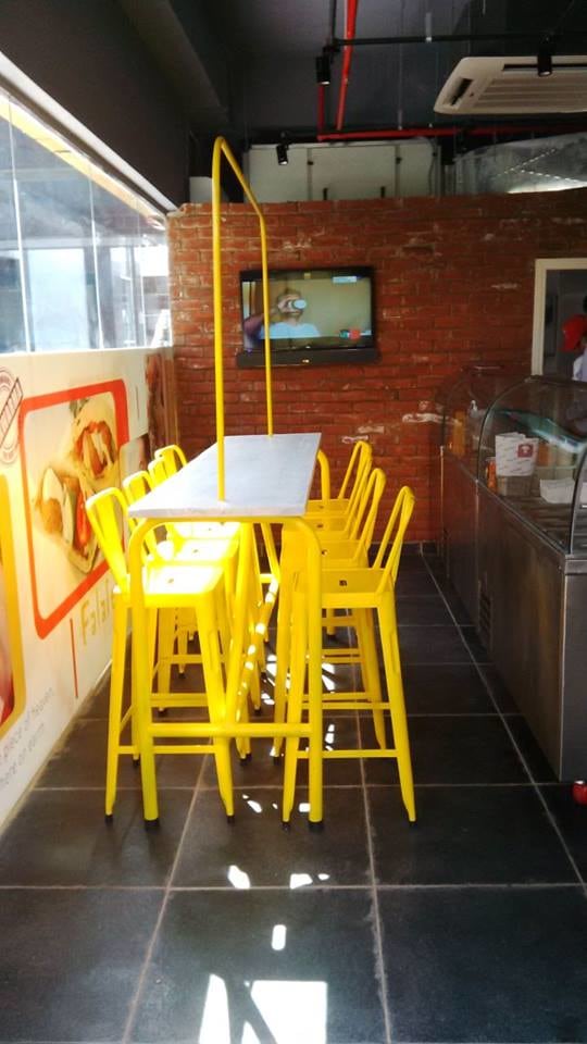 Cafeteria With Yellow Chairs and brick wall by Mohit Kumar Modern | Interior Design Photos & Ideas