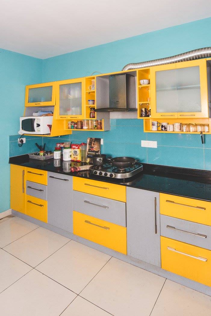 Grey And Yellow Themed Kitchen with Yellow Cabinets and Black Counter Top by Shyama Viswanathan Modular-kitchen Contemporary | Interior Design Photos & Ideas