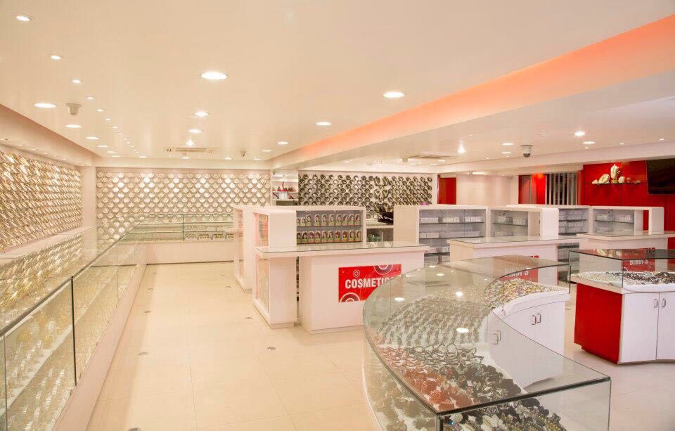 Red and White Showroom by Dinsignia Architects And Interiors Modern | Interior Design Photos & Ideas