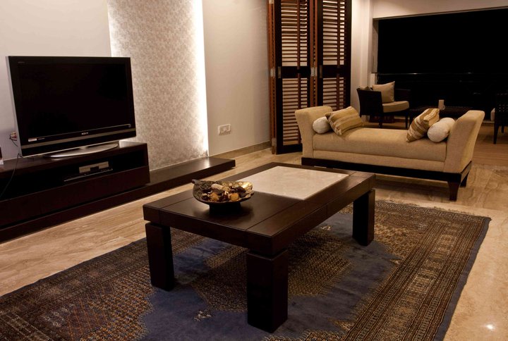 Wood and Caramel living Room by Dinsignia Architects And Interiors Living-room Modern | Interior Design Photos & Ideas