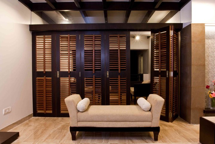 Wood and Caramel living Room by Dinsignia Architects And Interiors Living-room Modern | Interior Design Photos & Ideas