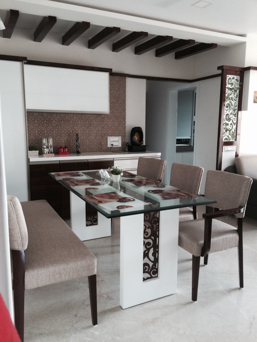 White Dining Room With Brown False Ceiling and Glass Top Table by Umesh Vishwakarma Dining-room Modern | Interior Design Photos & Ideas
