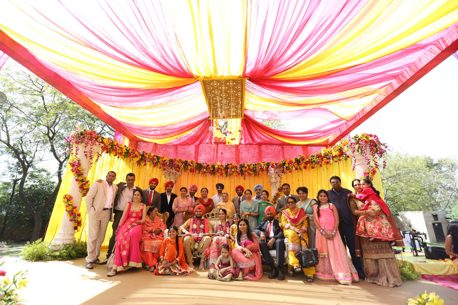 Bride and Groom Posing With Their Family On Their Wedding Day by Amit Kumar Wedding-photography Wedding-decor | Weddings Photos & Ideas