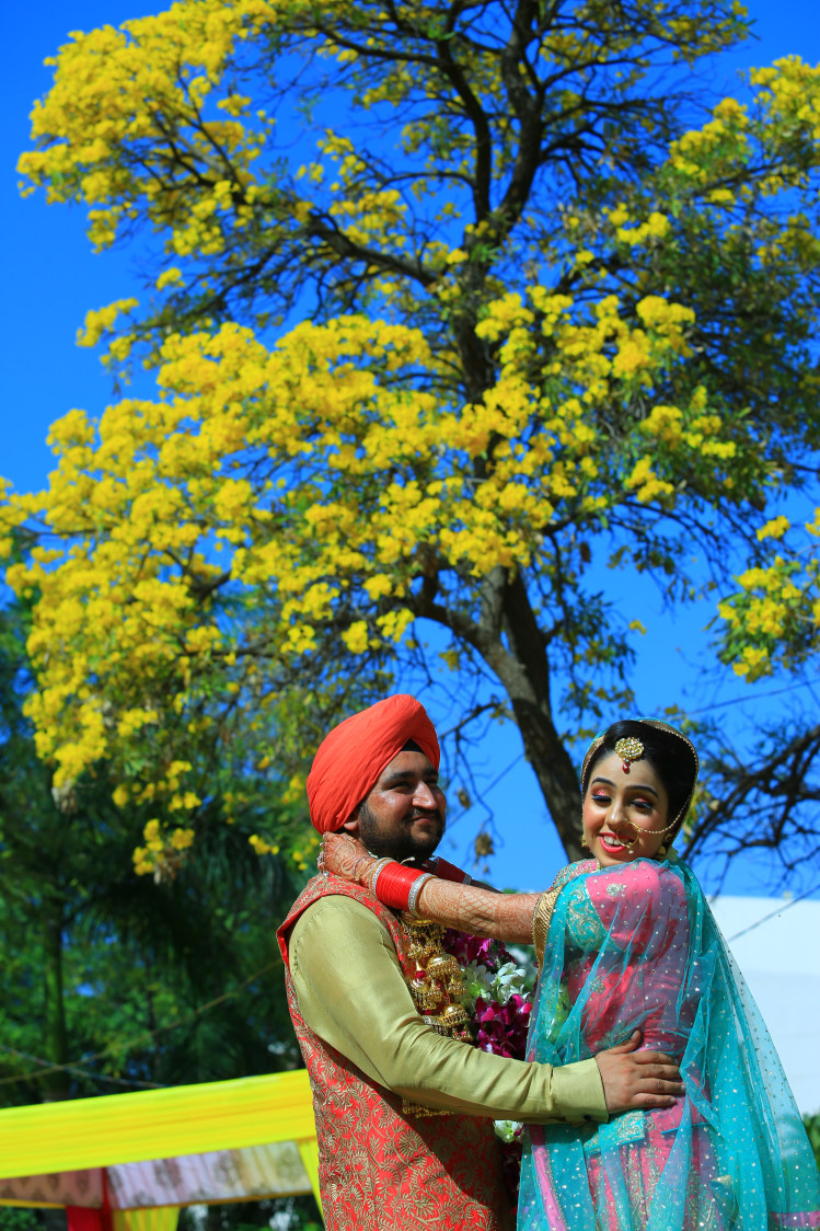 Punjabi Bride and Groom Posing on Their Wedding Day by Amit Kumar Wedding-photography | Weddings Photos & Ideas