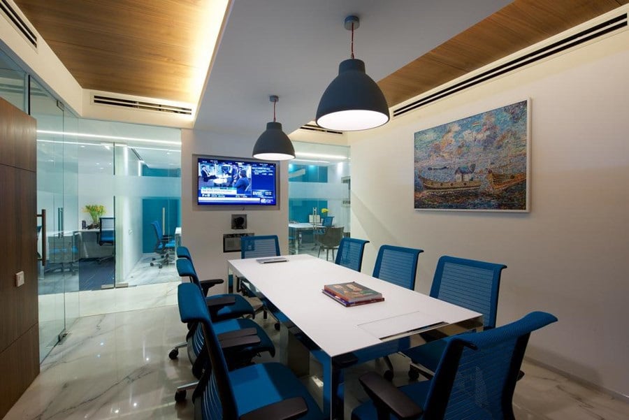 Cellular office space with white table and blue chairs with false ceiling by Siraj Contemporary | Interior Design Photos & Ideas