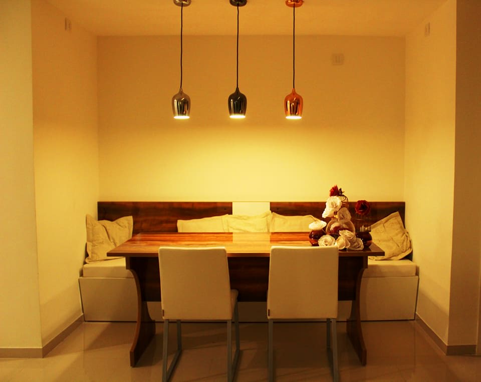 Modern living room with creamy chairs and wooden table by Ganesh Living-room Contemporary | Interior Design Photos & Ideas