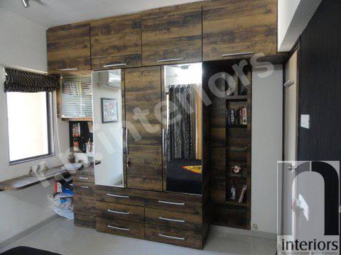 Minimalist Wooden Finished Wardrobe by Nilesh V. Gosavi Bedroom Minimalistic | Interior Design Photos & Ideas