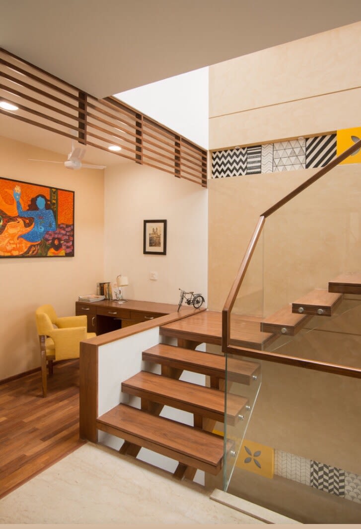 Walnut Brown Shaded Staircase With Glass Enclosure by Ganpat mistry Indoor-spaces Modern | Interior Design Photos & Ideas