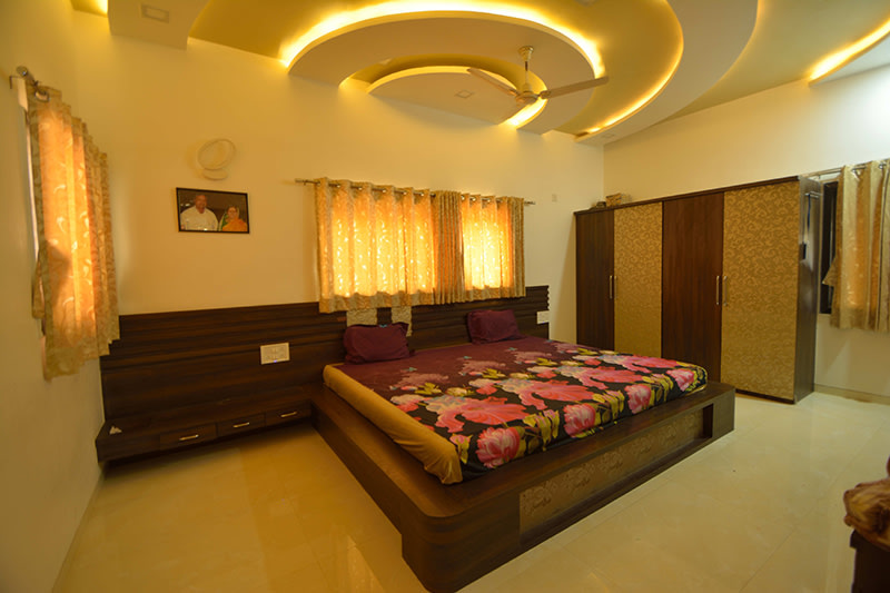 Elegant master bedroom with Wood Finished Furniture by Jayant Arwat Bedroom Modern | Interior Design Photos & Ideas