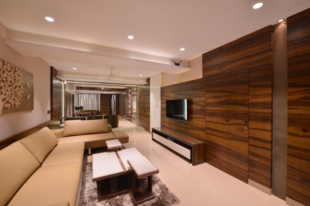 Spacious Living Room With Sectional Sofa And Wooden Center Table by Jeetan Ranpura Living-room Modern | Interior Design Photos & Ideas