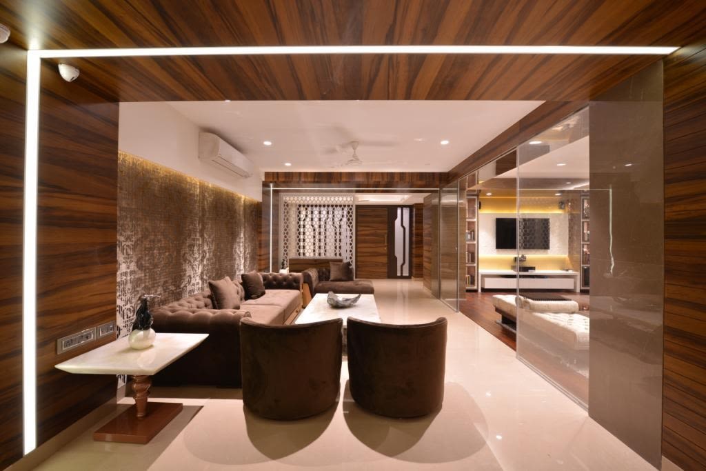 Spacious Living Room With Brown Sofas And Curve Lounge Chairs by Jeetan Ranpura Living-room Contemporary | Interior Design Photos & Ideas