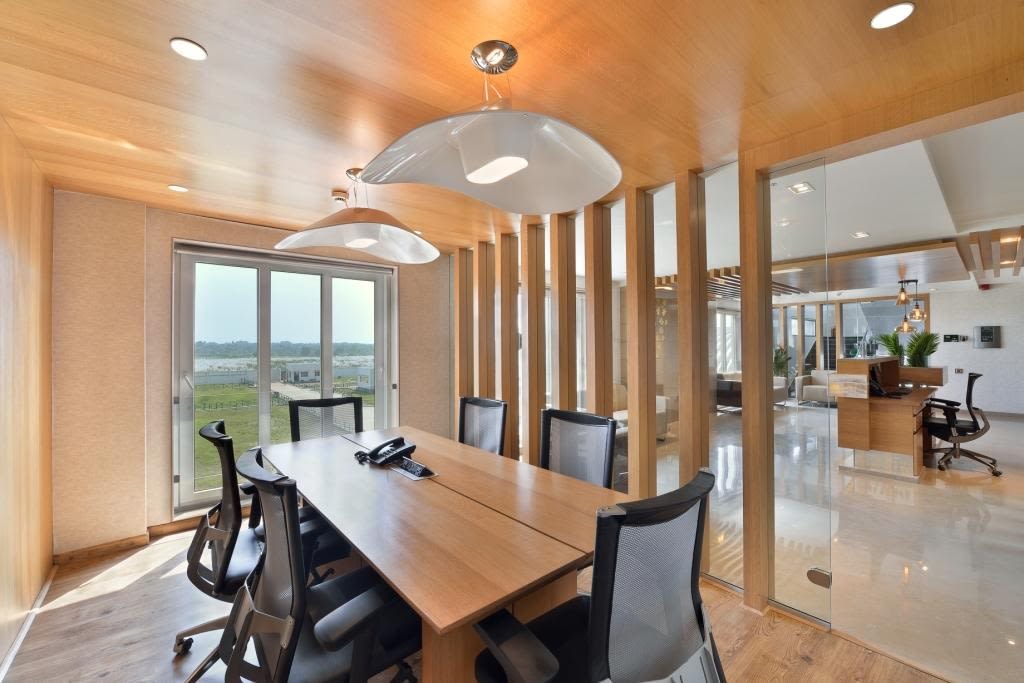 Wooden Sleek Table With Black Chairs In Meeting Room by Jeetan Ranpura Modern | Interior Design Photos & Ideas