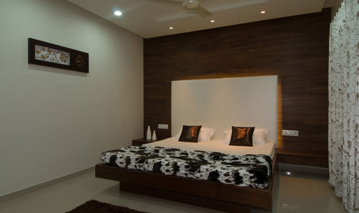Low Rise Wooden Bed And White Head Cover by Deepti Srivastava Bedroom Contemporary | Interior Design Photos & Ideas