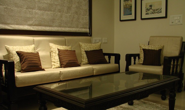 Wooden Cushioned Sofa And Glass Top Table by Deepti Srivastava Living-room Modern | Interior Design Photos & Ideas