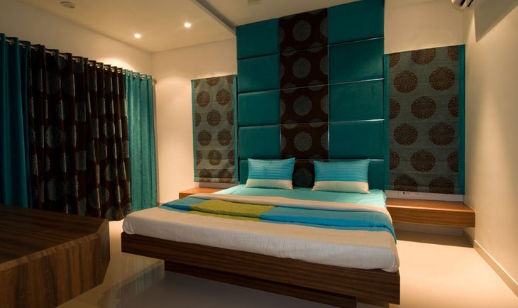 Low Rise Wooden Bed And Prussian Blue Head Cover by Deepti Srivastava Bedroom Minimalistic | Interior Design Photos & Ideas