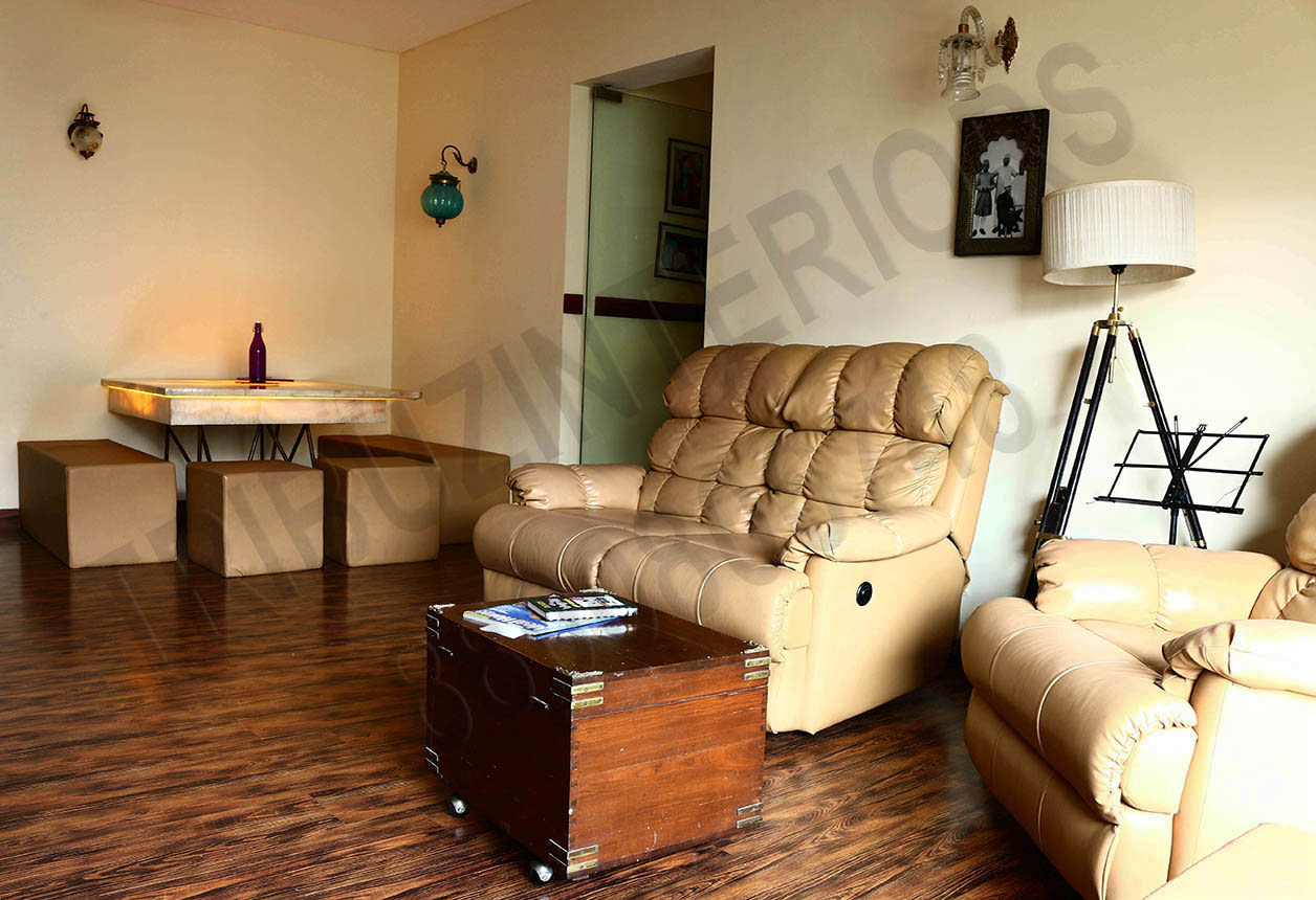 Simple Living Room With Leather Sofa Set And Wooden Centre Table by Tribuz Interiors Pvt. Ltd. Living-room Contemporary | Interior Design Photos & Ideas