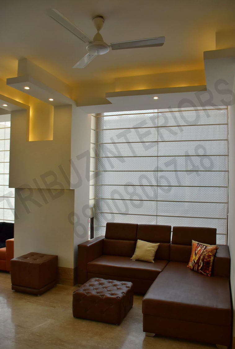 Living Room With Brown L-Shaped Sofa And False ceiling by Tribuz Interiors Pvt. Ltd. Living-room Contemporary | Interior Design Photos & Ideas