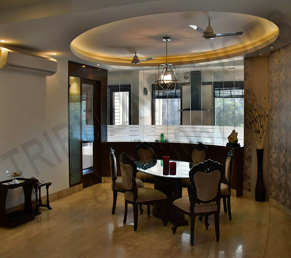 Dining Area With Glass Finish Table And Cushioned Chair by Tribuz Interiors Pvt. Ltd. Dining-room Contemporary | Interior Design Photos & Ideas