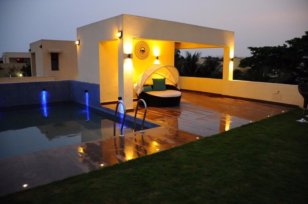 Lavish Swimming Pool Area With Wooden Flooring by Rohit Mangal Singla Open-spaces Modern | Interior Design Photos & Ideas