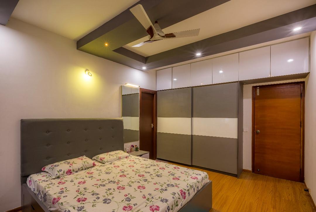 Contemporary bedroom with wooden flooring by Shubhashis Shomil Bedroom Contemporary | Interior Design Photos & Ideas