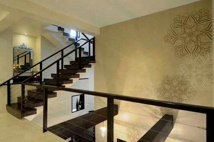 Hallway with staircase and wall decor by Milind Kapadia Indoor-spaces Modern | Interior Design Photos & Ideas
