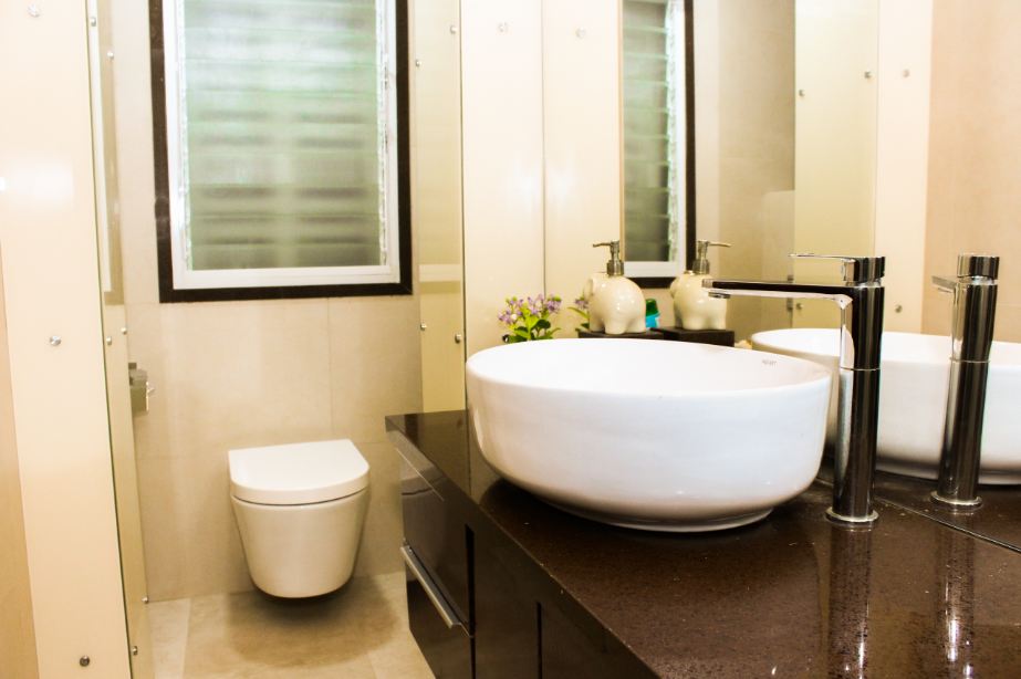 Dark Brown Cabinet In Beige Bathroom Interior by VERSATILE INTERIORS Bathroom Modern | Interior Design Photos & Ideas