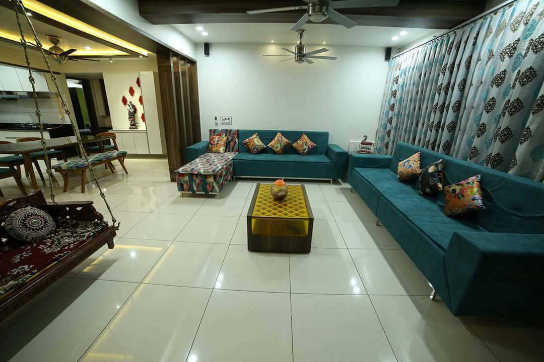 L shape sofa with colored cushions and false ceiling by Chandni Goel Living-room Contemporary | Interior Design Photos & Ideas